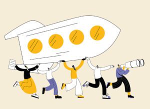 persone che alzano in alto un razzo in team