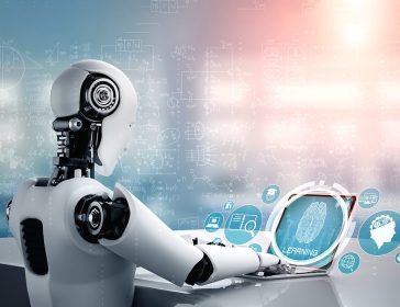 Robot humanoid use laptop and sit at table in concept of AI thinking brain
